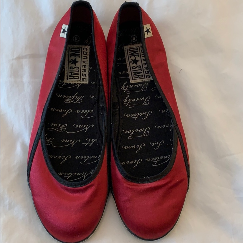 Red satin flats with black trim